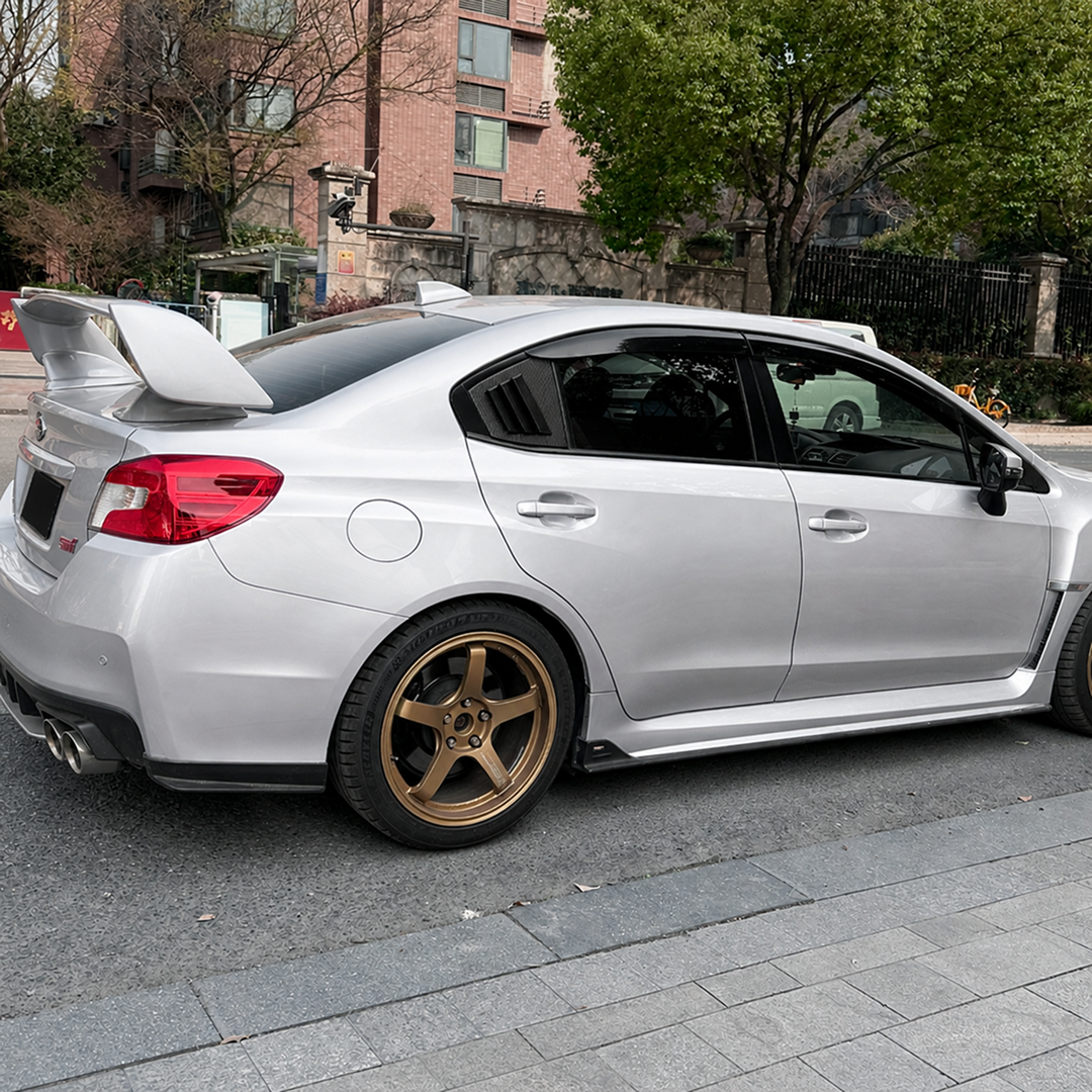 Side perspective highlighting the aerodynamic profile of the carbon print rear quarter trim