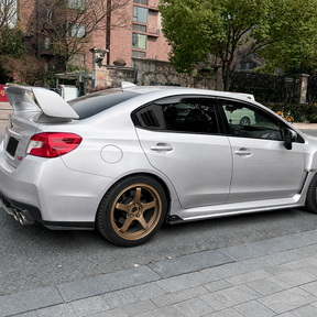 Side perspective highlighting the aerodynamic profile of the carbon print rear quarter trim
