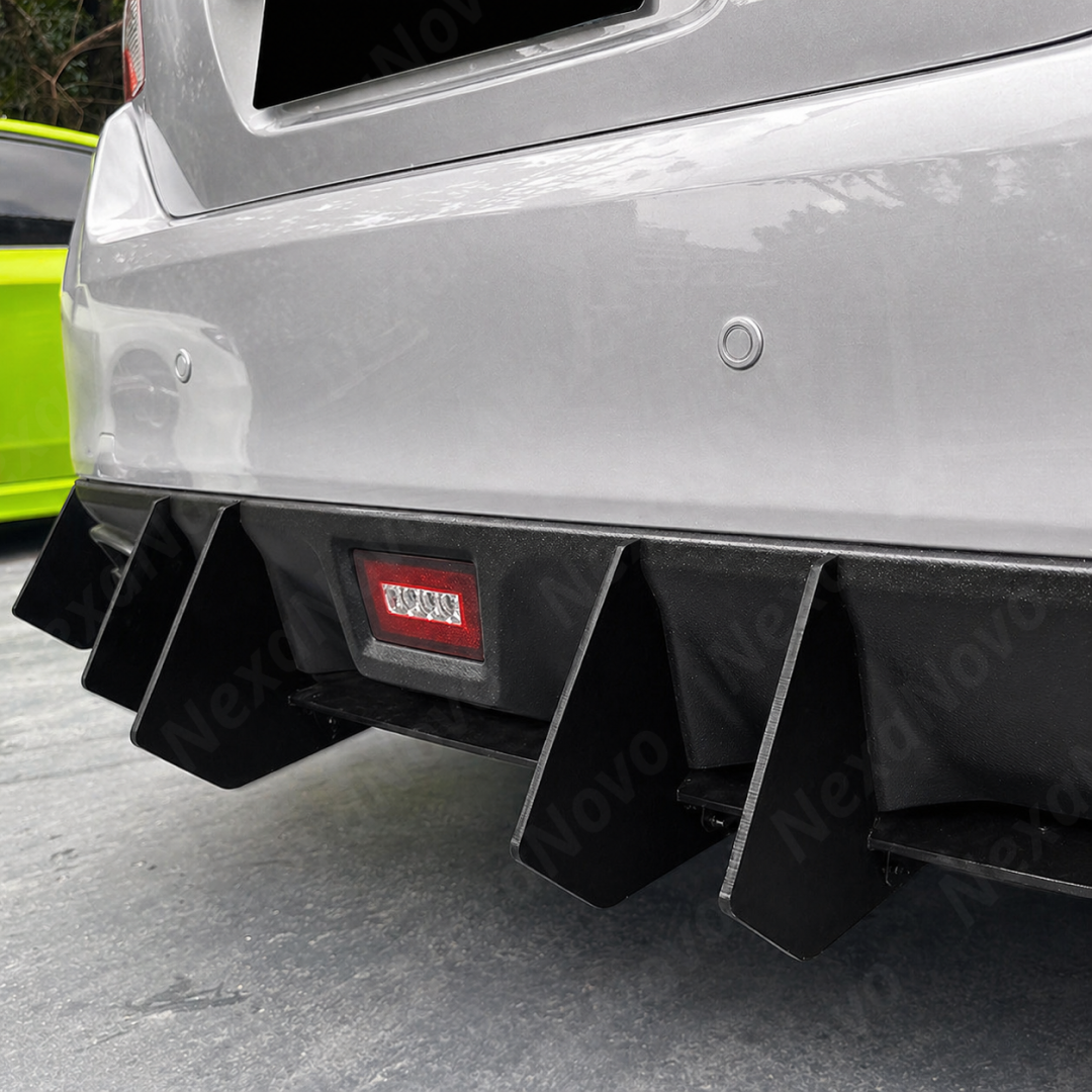 Low-profile shot showing the vertical alignment of the gloss black shark fins on the VA bumper