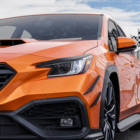 Aggressive carbon print headlight accent trim installed on a 2023 Subaru WRX VB