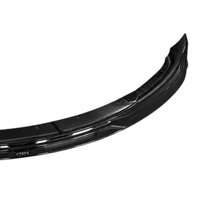 Stealth performance look of the NexaNovo VTEN gloss black 1-piece bumper lip accenting a Solid Black Tesla Model 3