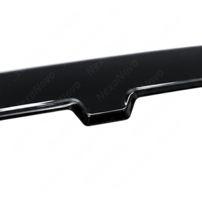Detailed close-up of the mirror-finish gloss black clear coat on the NexaNovo trunk spoiler