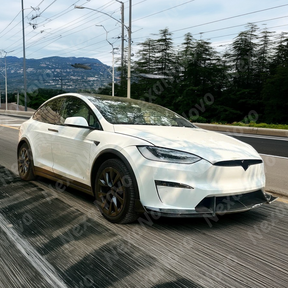 NexaNovo real carbon fiber front splitter on a white Tesla Model X