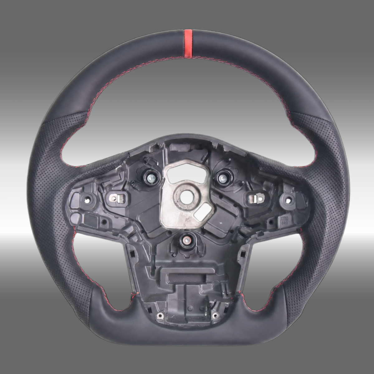Custom sport steering wheel in black leather with red center stripe installed in a Toyota GR Supra A90 cockpit