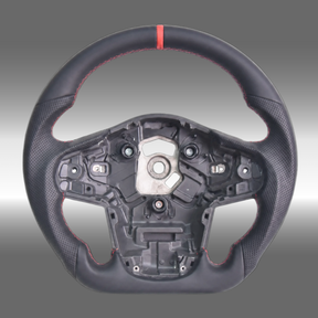 Custom sport steering wheel in black leather with red center stripe installed in a Toyota GR Supra A90 cockpit