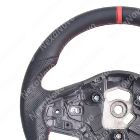 Wide-angle interior shot displaying the upgraded sport steering wheel integrating with the Supra A90 center console