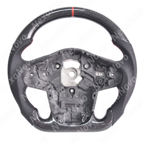 Close-up perspective highlighting clearance and fitment with OEM paddle shifters behind the carbon fiber rim
