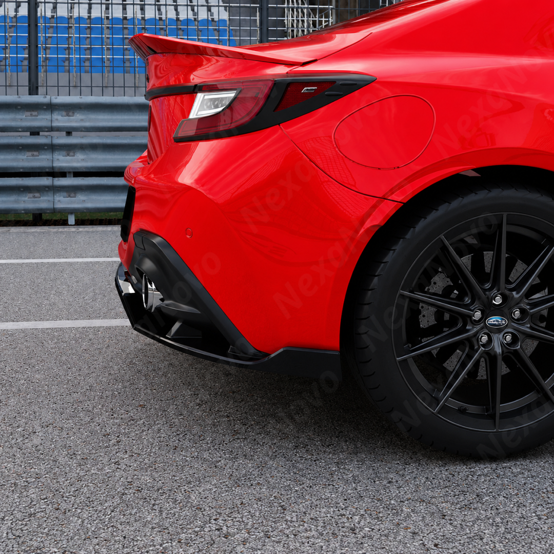 GT-style gloss black rear bumper diffuser kit installed on a 2022 Toyota GR86.