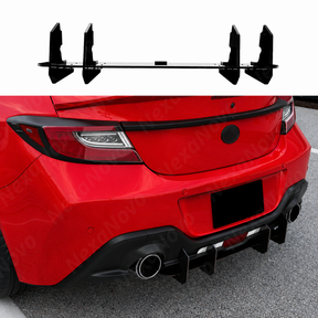 Close-up of the high-gloss shark fin vertical stabilizers on the 2024 Subaru BRZ rear bumper.