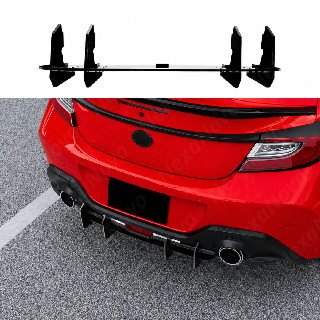 Gloss black V-style diffuser fins providing a sharp, aggressive contrast on an Ignition Red Toyota GR86.