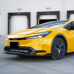 Front-end shot emphasizing the widened, sporty stance of the Prius with NexaNovo aero