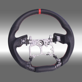 TRD style custom black leather steering wheel with top red center stripe installed in a Toyota 4Runner cabin