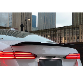 NexaNovo gloss black V style rear spoiler wing for BMW M550i xDrive 2024-2025 M-Pack trims.
