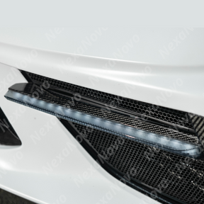 NexaNovo carbon fiber sequential LED DRL light bar bezel insert on a white C8 Corvette