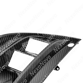 NexaNovo carbon fiber lens covers integrated on a black Cadillac CTS