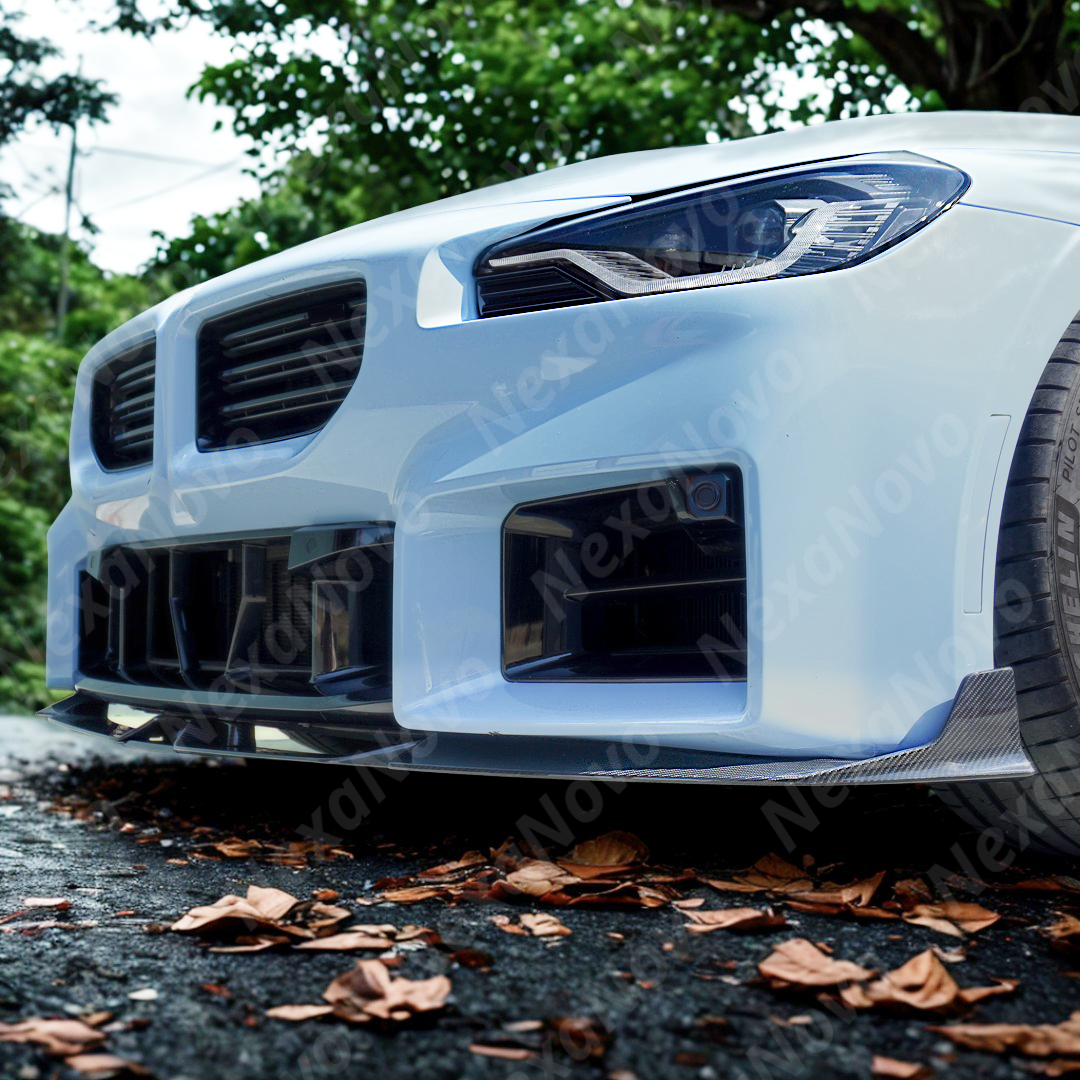 Underside view of NexaNovo carbon fiber front lip showing mounting points