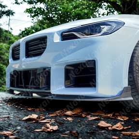 Underside view of NexaNovo carbon fiber front lip showing mounting points