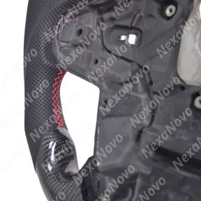 Detailed close-up of the breathable perforated leather side grip and ergonomic 10-and-2 palm swells