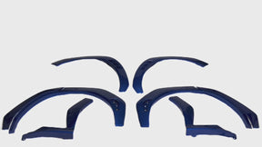 Aggressive Nexanovo K7X WR Blue Pearl fender flares enhancing a Subaru WRX

