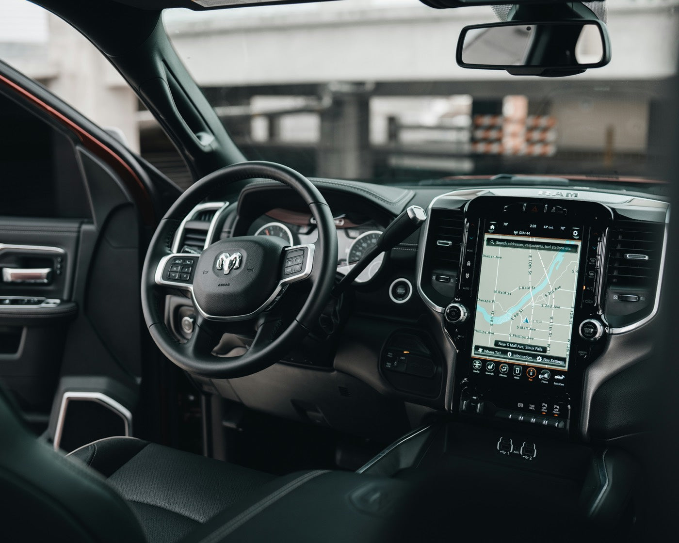 Custom leather steering wheel in a RAM truck interior